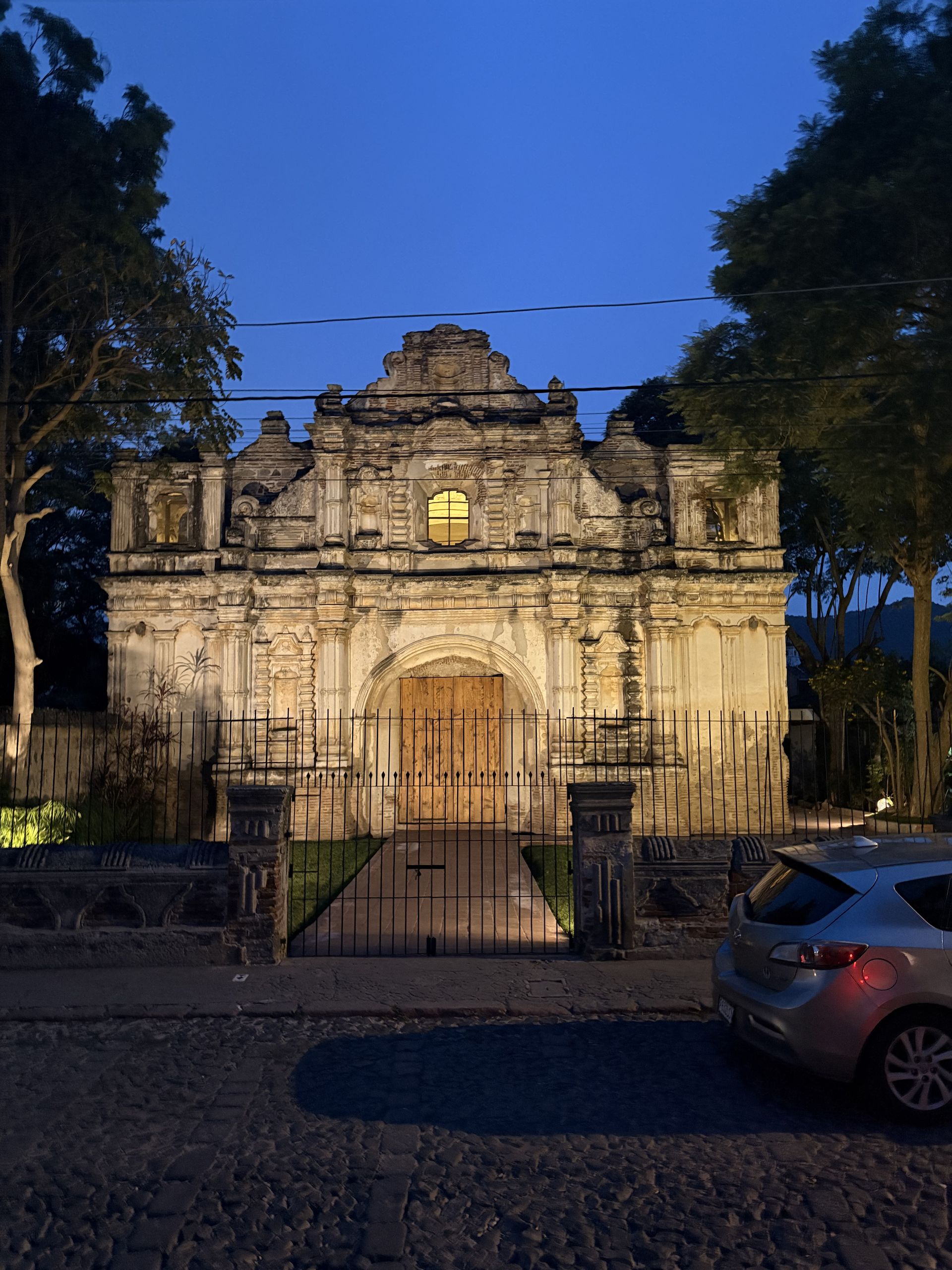 Baroque church facade in Antigua Guatemala lit at dusk
