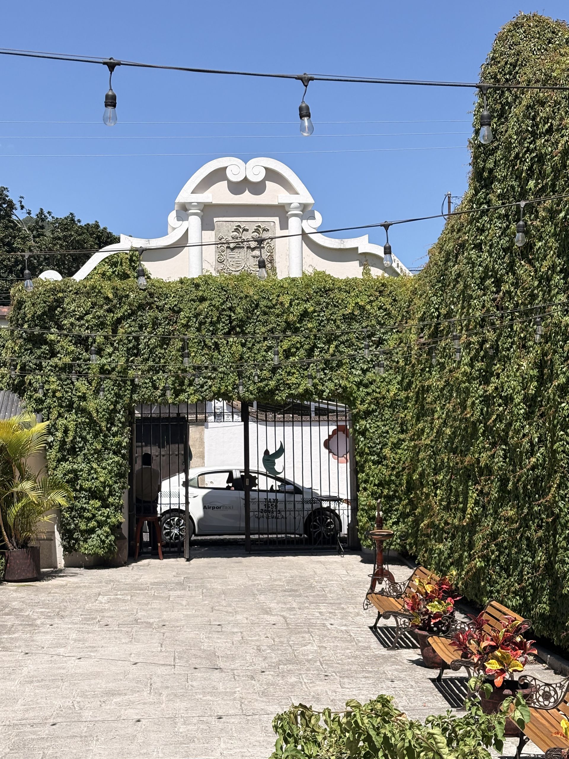Ivy-covered gateway and cobbled courtyard in Antigua Guatemala