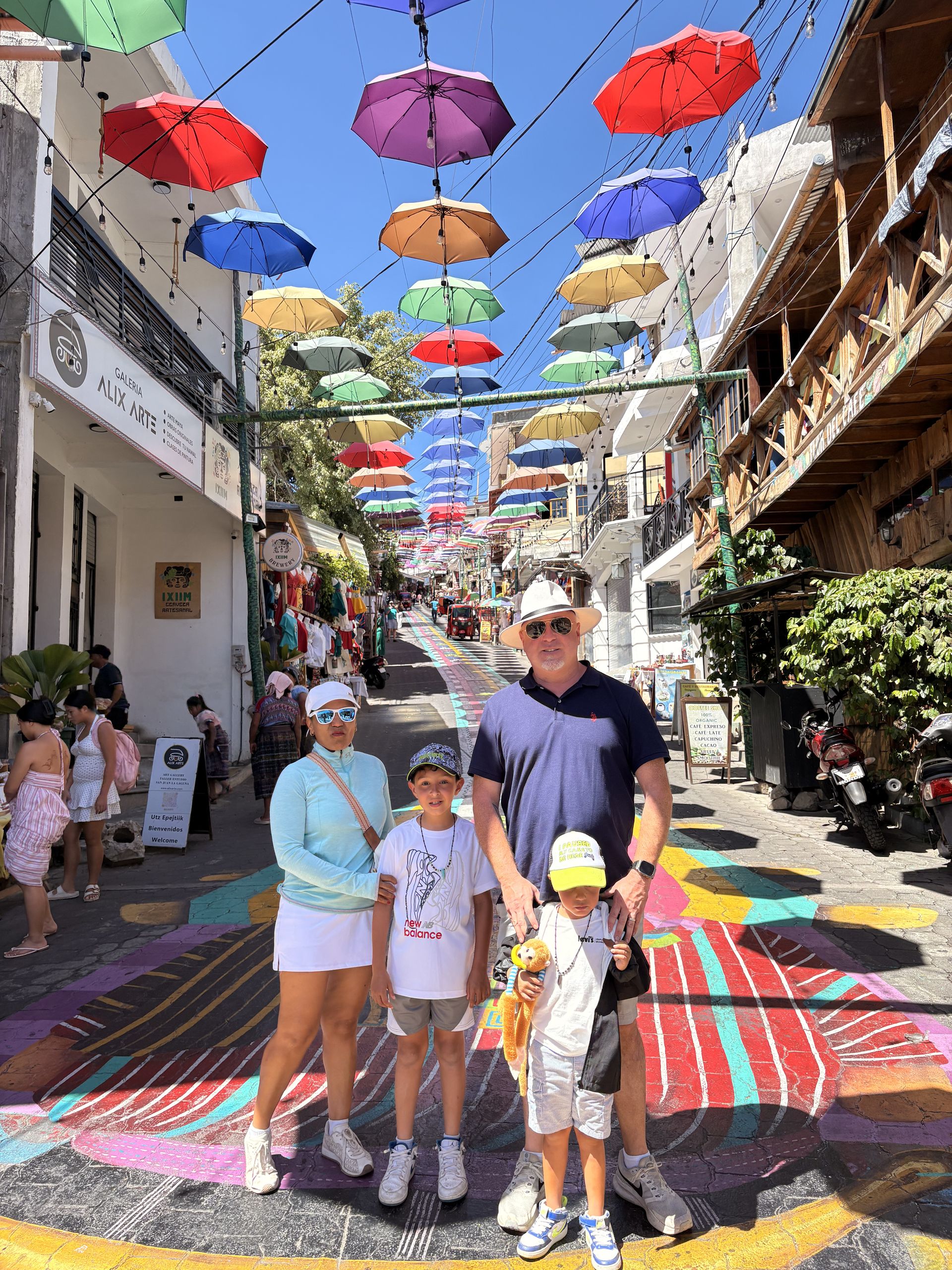 Street strung with colorful umbrellas in Antigua Guatemala