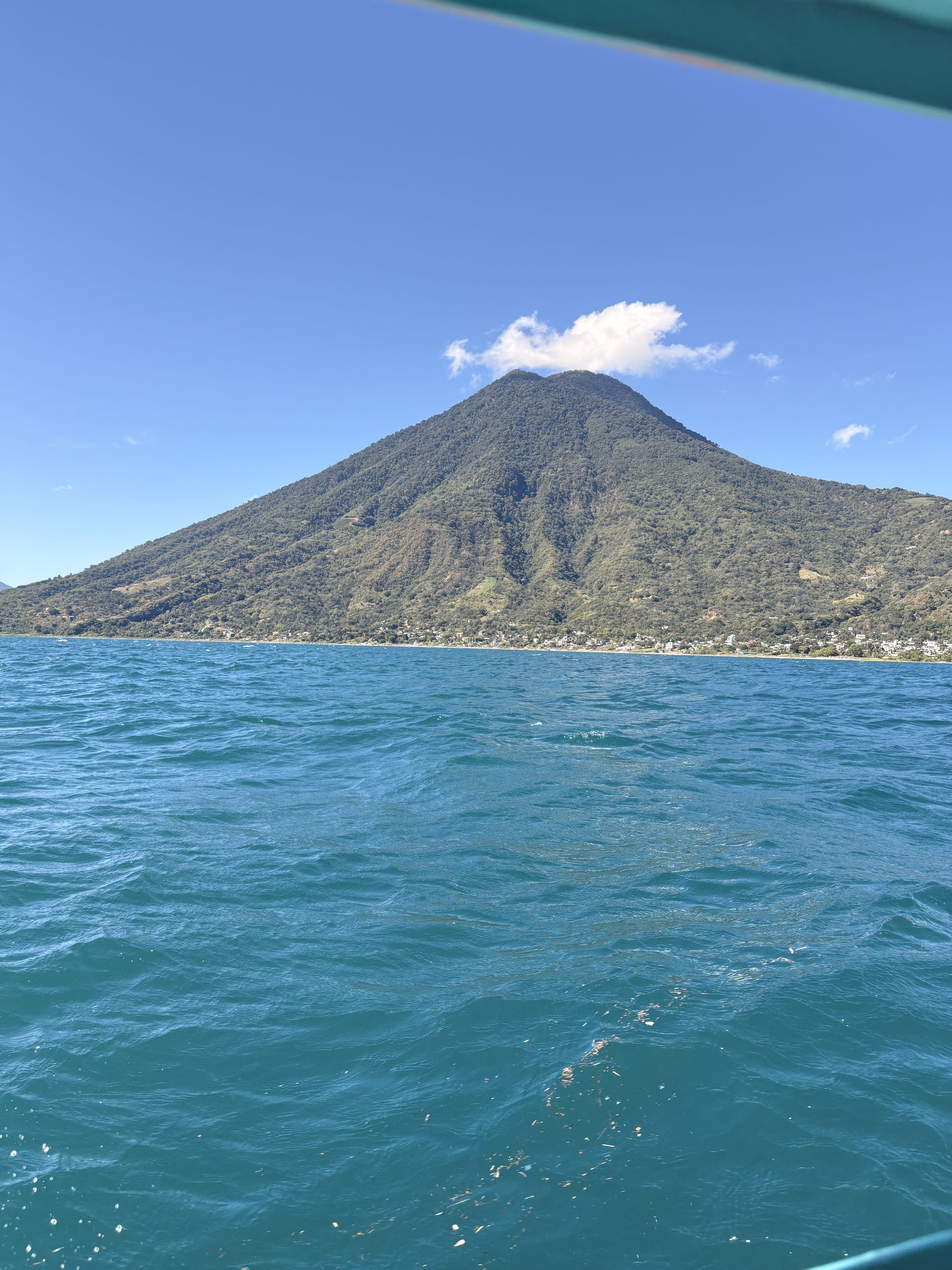 Volcano and deep blue water of Lake Atitlán, Guatemala
